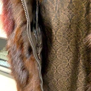 Brand new with tags Sable brown and crystal fox vest. Size regular.